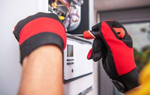 technician-repairs-broken-gas-heater-device-2022-12-16-11-41-26-utc-min